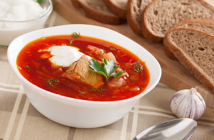 Borscht soup with sour cream and bread