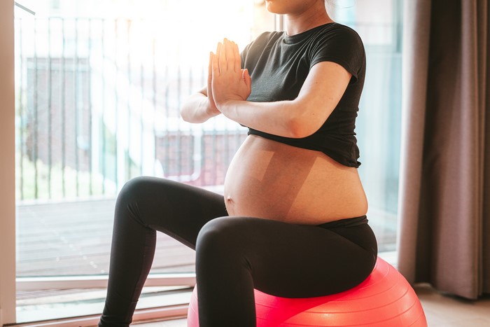 Pregnant Woman Doing Yoga on Exercise Ball