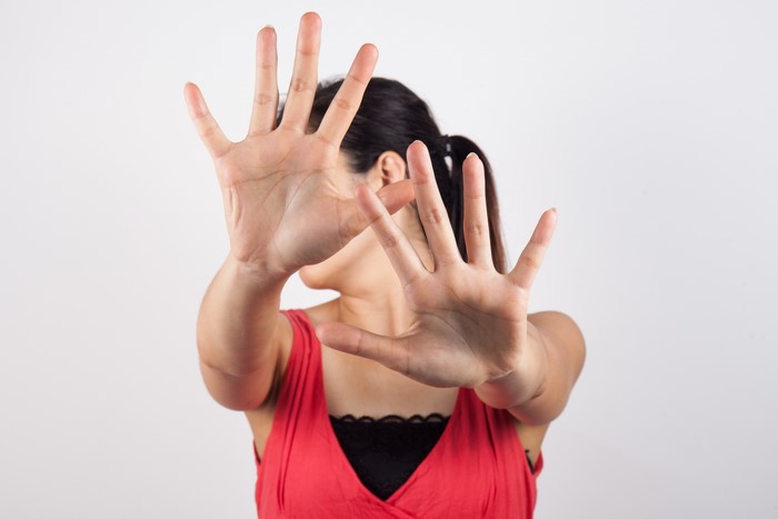 Woman making a stop gesture with hands
