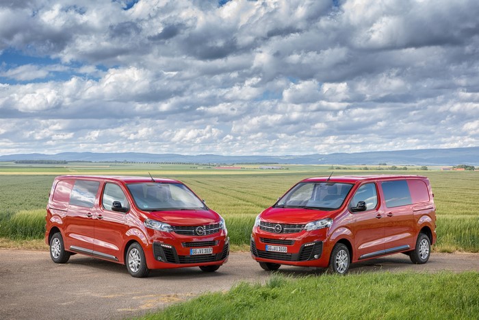 Two red 2019-2020 Opel Vivaro vans