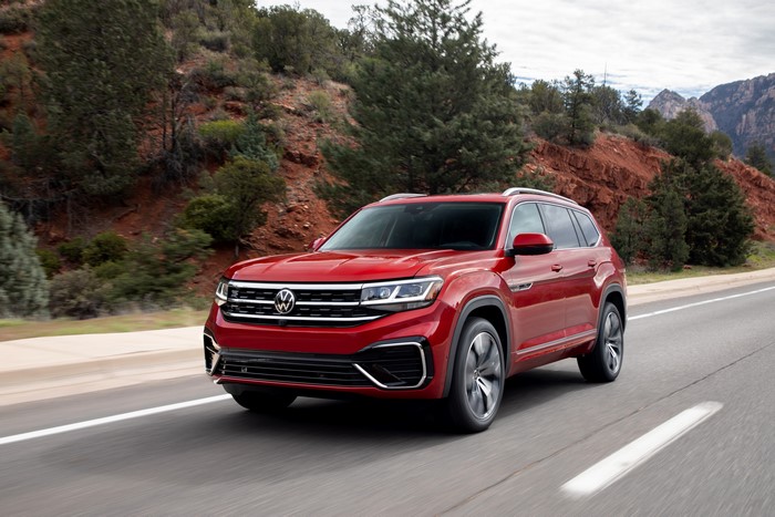 Red Volkswagen Atlas driving on a road