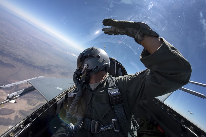 F-16 Fighting Falcon Pilot in Cockpit with Sidewinder Missile