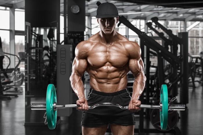 4K Muscular Man Working Out in Gym