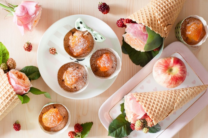 Cupcakes with fruit, roses, and ice cream cones
