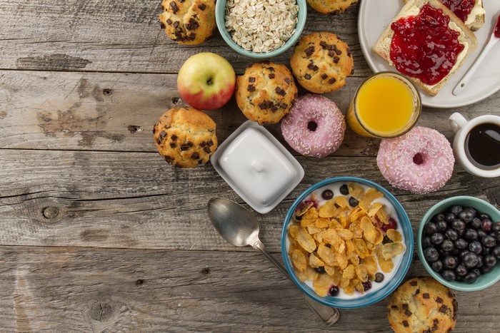 Breakfast with Muffins, Donuts, Juice, and Coffee