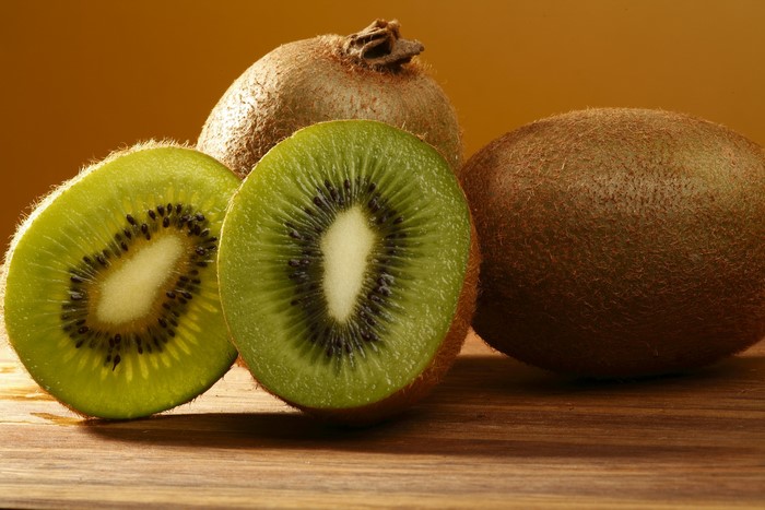 Kiwi fruit on a wooden surface