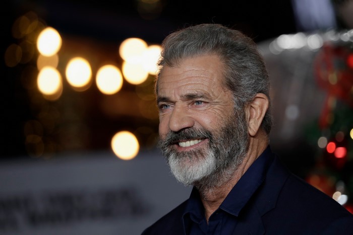Mel Gibson smiling with a beard