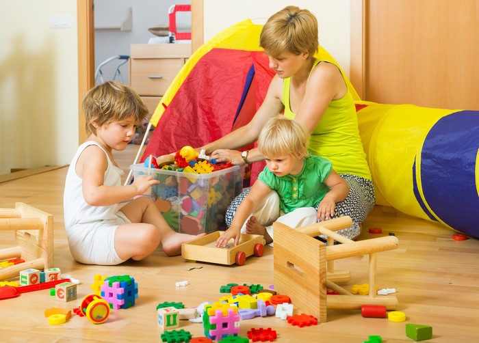 Mother and Children Playing with Toys