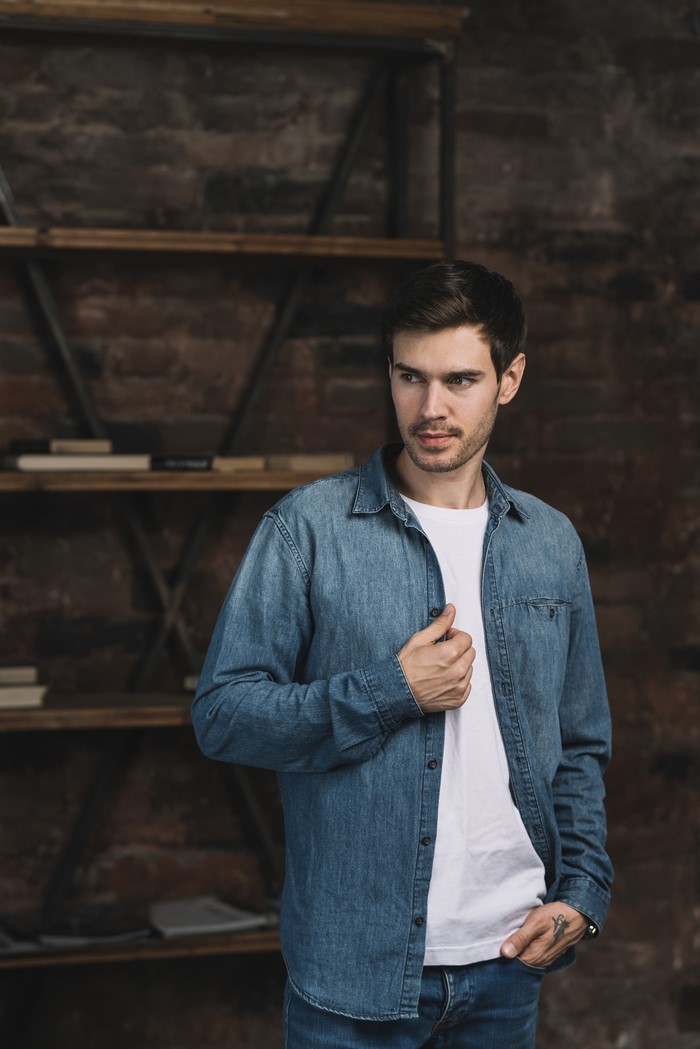 Man in denim jacket and white t-shirt