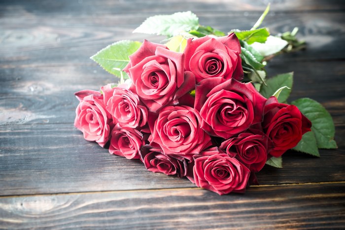 Bouquet of Red Roses on Wood Planks