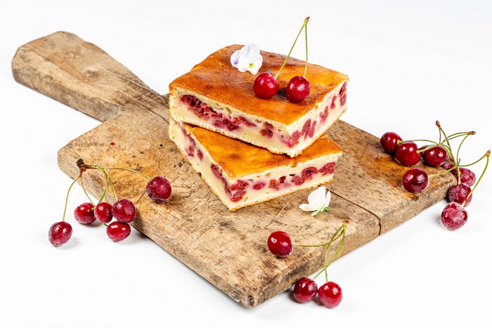 Cherry pie slices on a cutting board