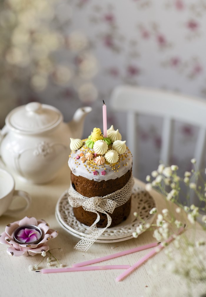 Easter Kulich cake with candle and decorations