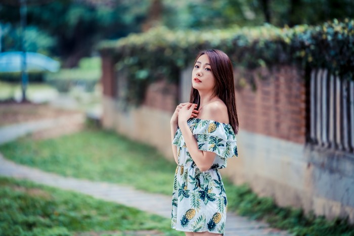 Asian woman in a floral dress