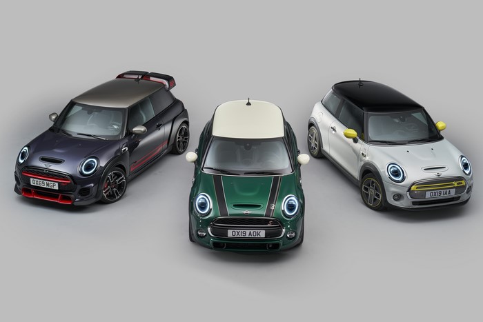 Three Mini Hatch cars on a gray background