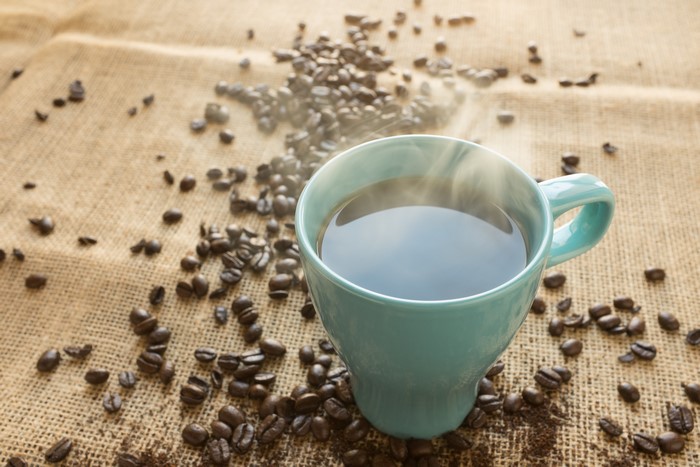 Hot Coffee in a Mug with Beans