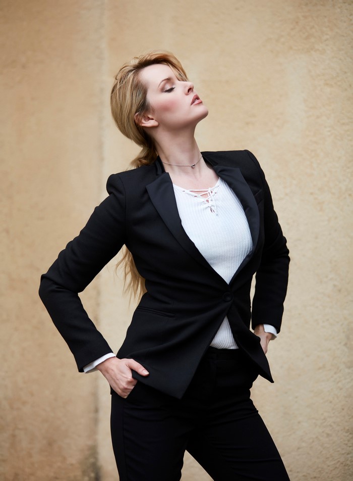 Carla Monaco in a black suit