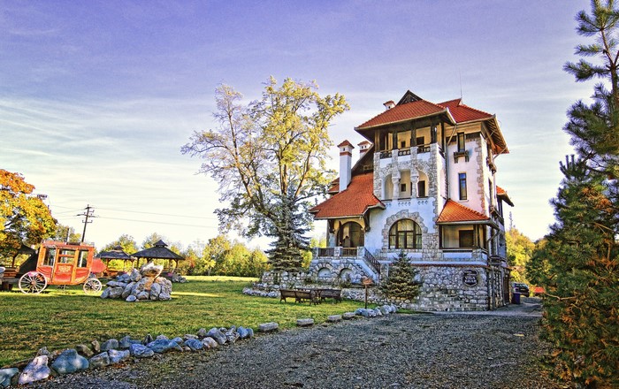 Mansion in Comuna Bran Brasov, Romania with horse carriage