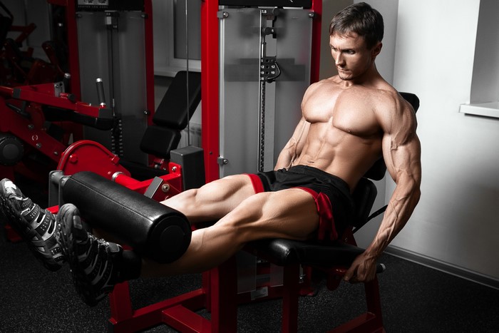 Muscular Man Working Out in Gym