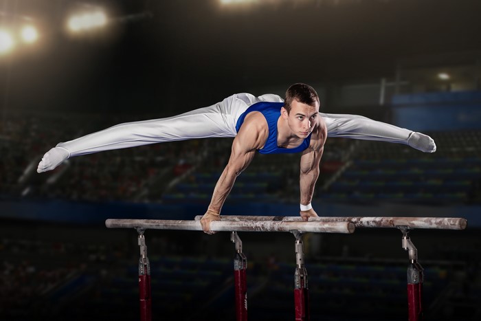 Gymnast performing on parallel bars