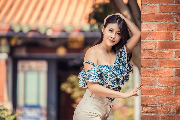 4K Asian Woman Posing by Brick Wall