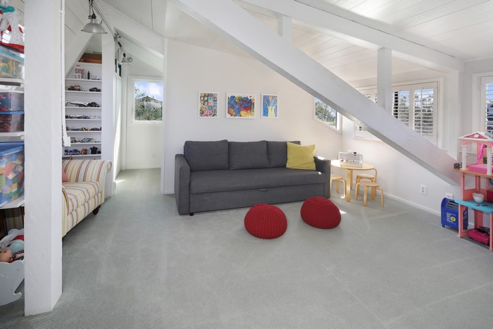 Children's room interior with sofa and toys