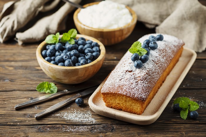 Pound cake with blueberries and powdered sugar