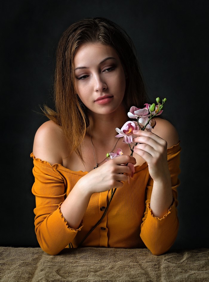 Woman holding orchid flowers