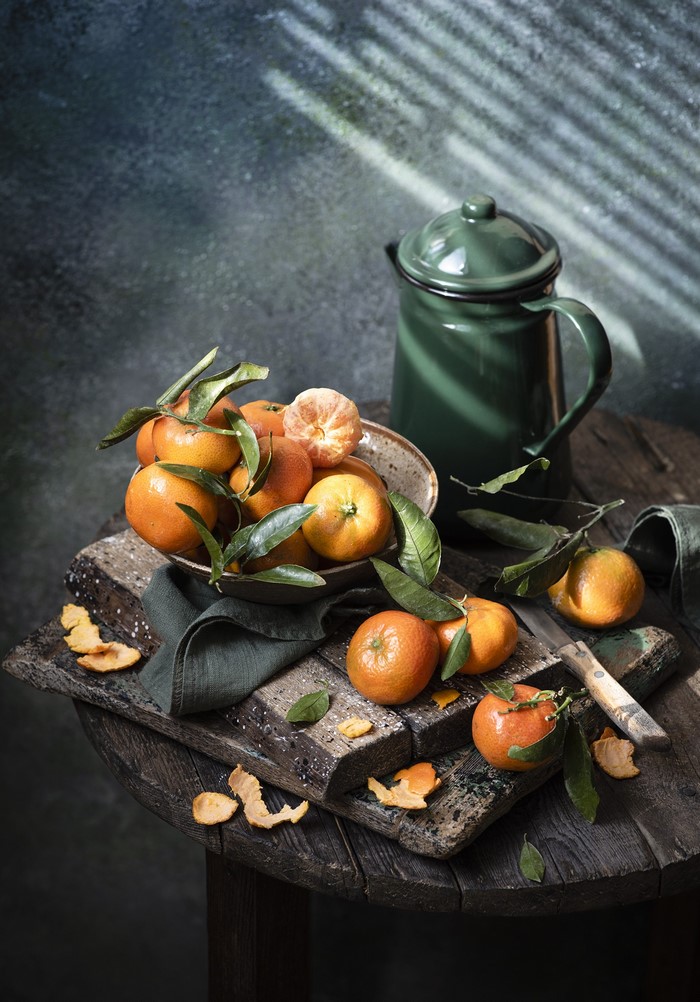 Still life with tangerines and a green jug