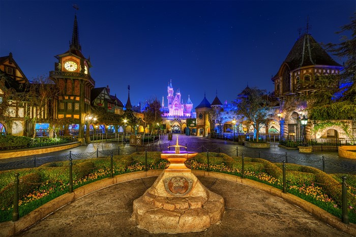 Disneyland Fantasyland at night with sword in the stone