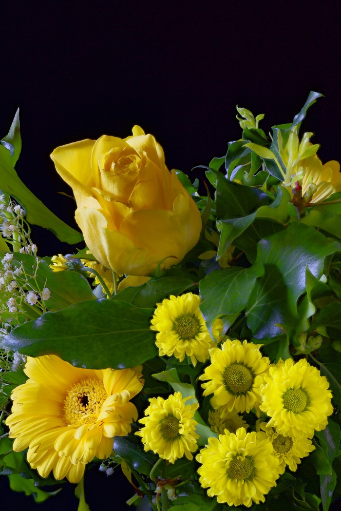 Yellow roses, gerberas, and chrysanthemums with greenery