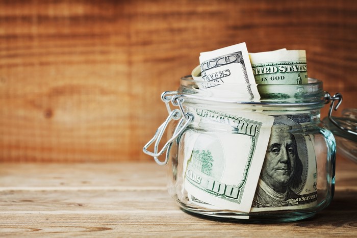 US Dollars in a Glass Jar