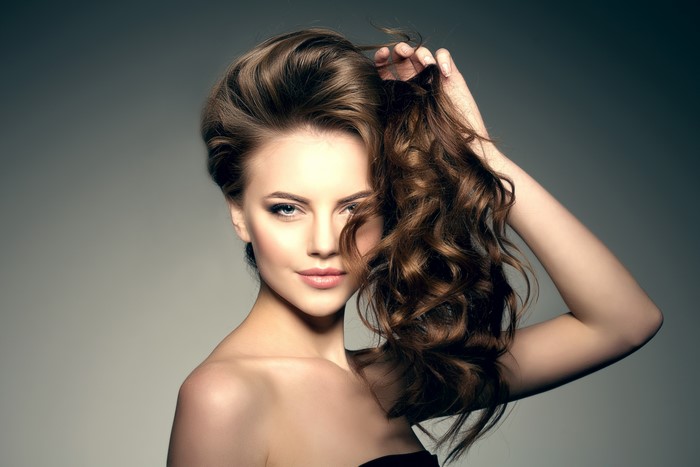 Beautiful woman with brown hair and makeup