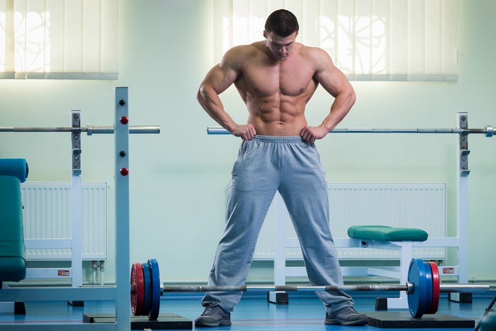 Man with Barbell in Gym