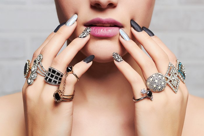 Woman with elaborate rings and manicured nails