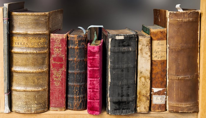 Collection of old books on a shelf