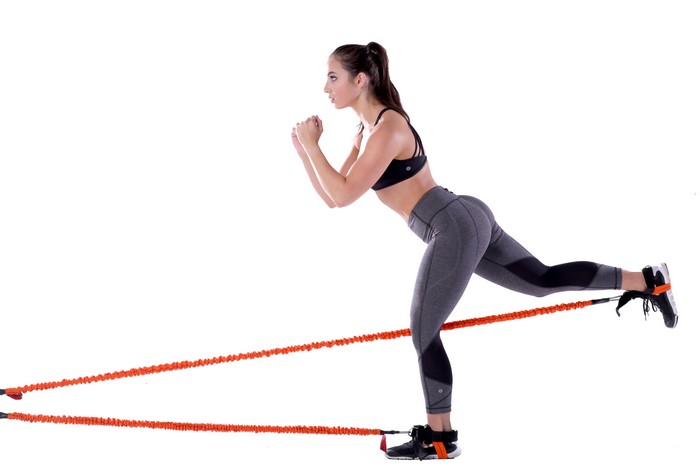 Woman exercising with resistance bands