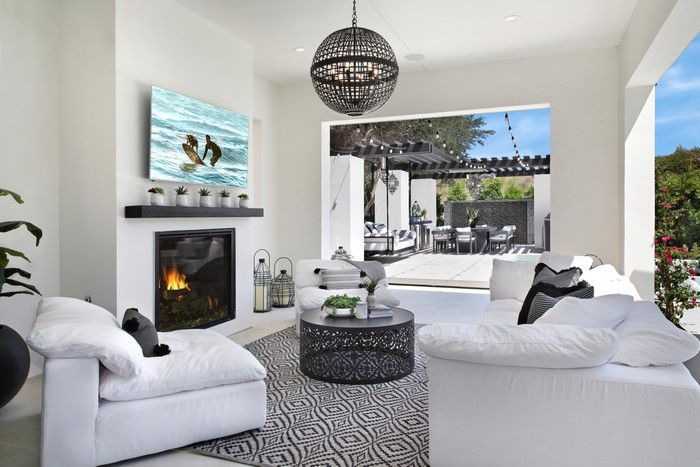 Living room with fireplace and outdoor patio