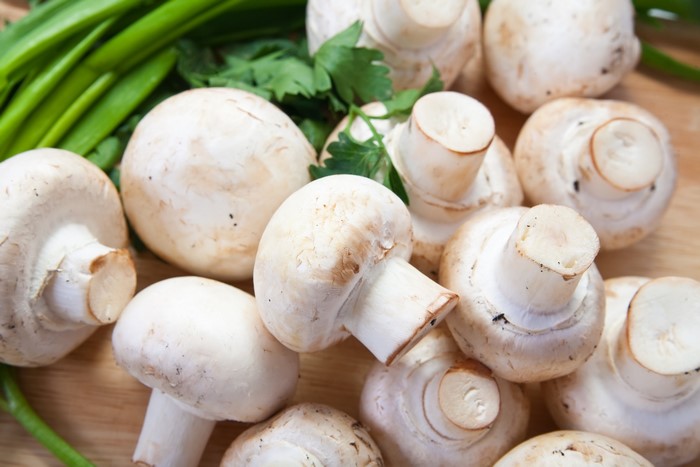 Champignon mushrooms with parsley and green onions