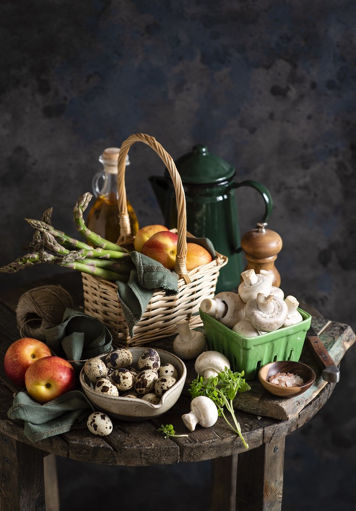 Still life with apples, asparagus, mushrooms, and quail eggs