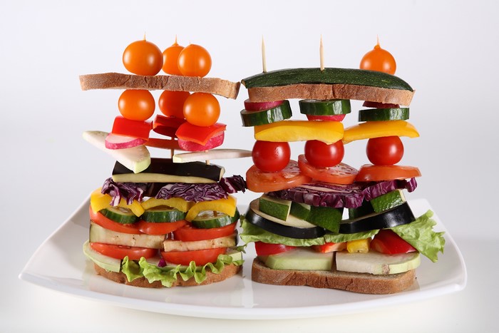 Creative vegetable sandwiches with tomatoes and bread