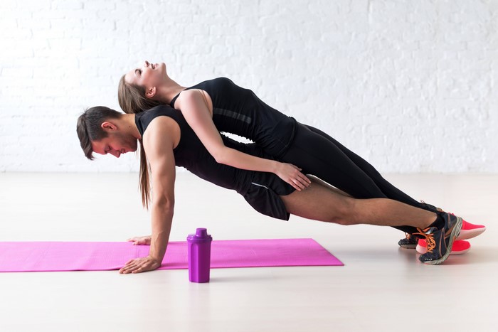 Couple doing a plank workout together
