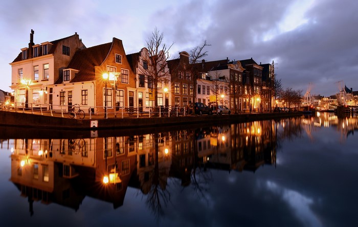 Houses along a canal in Haarlem, Netherlands at dusk