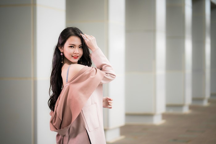 Brunette girl with long hair and earrings