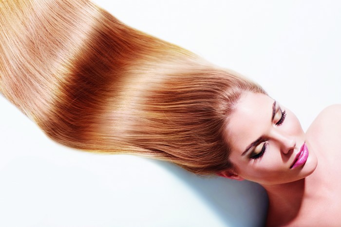 Model with long blonde hair and makeup