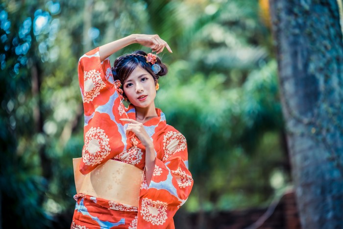Asian woman in kimono with flowers in hair
