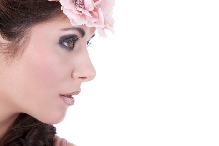 Model with flower wreath and makeup