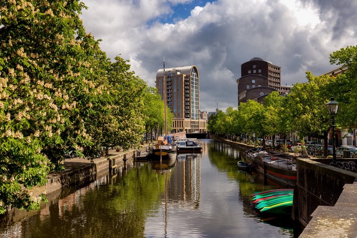 Canal in The Hague, Netherlands with boats and buildings