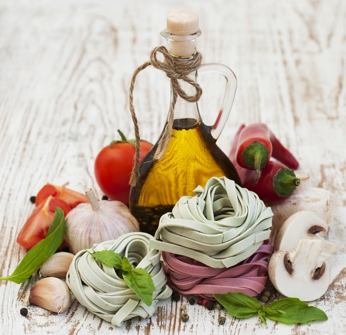 Pasta ingredients with olive oil bottle