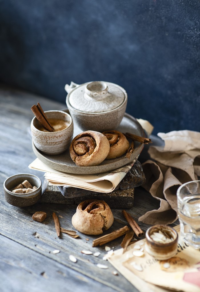 Cinnamon rolls and coffee on a wooden table