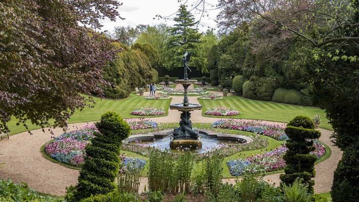 Ascott House Gardens fountain and flower beds in England